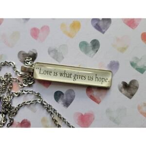 Love is What Gives Us Hope pendant necklace made from Girls of Paper and Fire